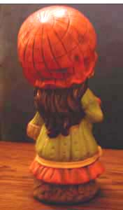 Ceramic Girl with Big Orange Hat carrying Basket Pic 2